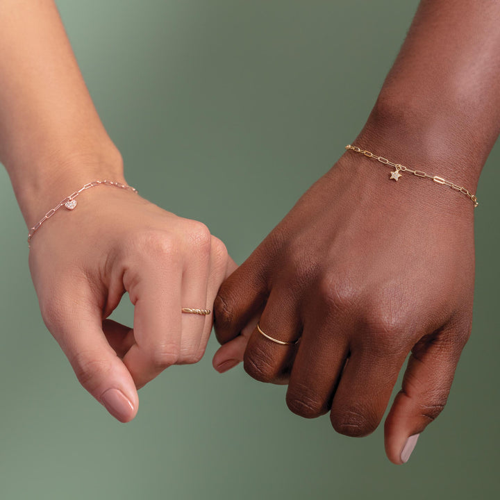 14k gold miniature heart dangle on bracelet.#primary-stone-type_diamond