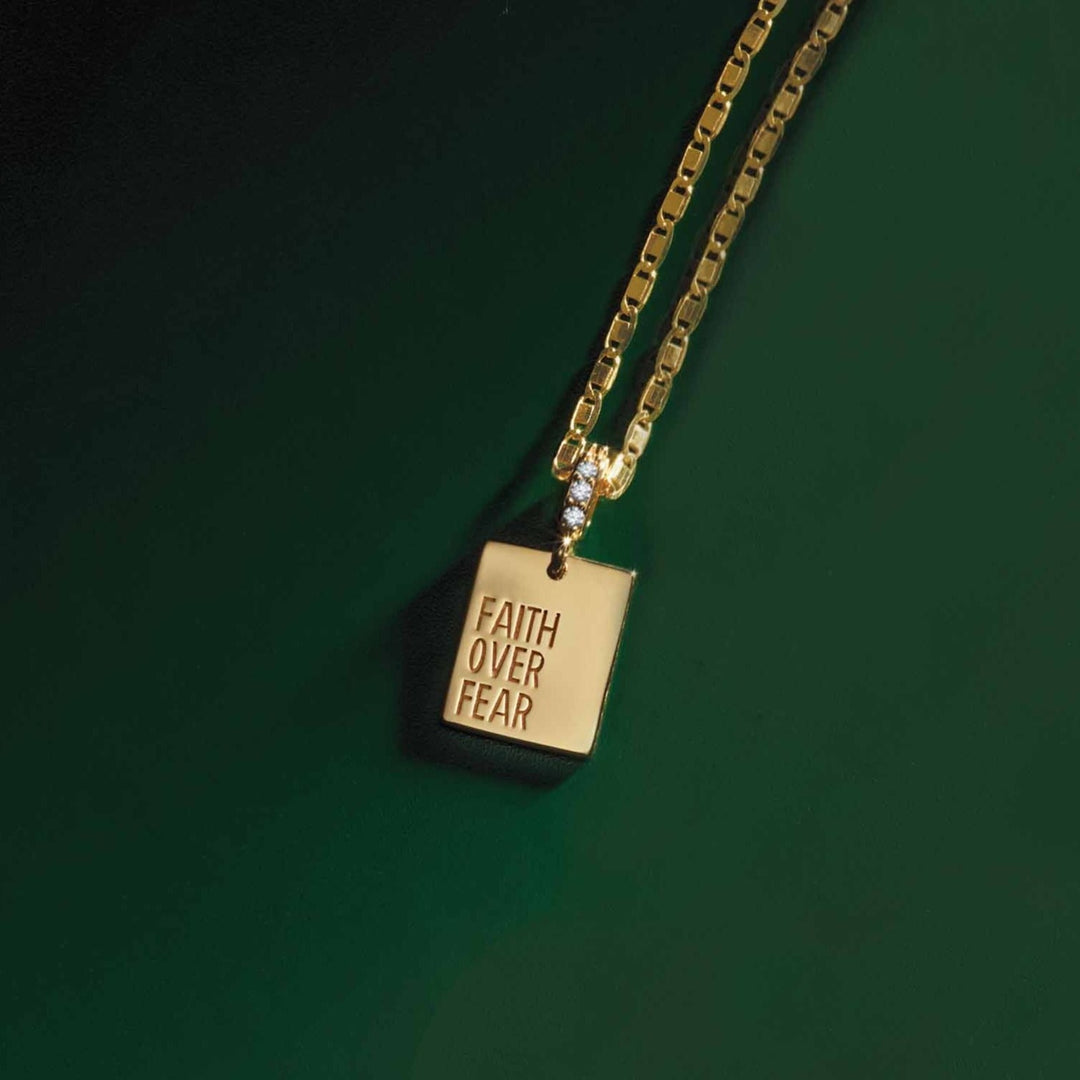 14k gold diamond "Faith Over Fear" pendant on 1.3mm mirror Valentino link chain.