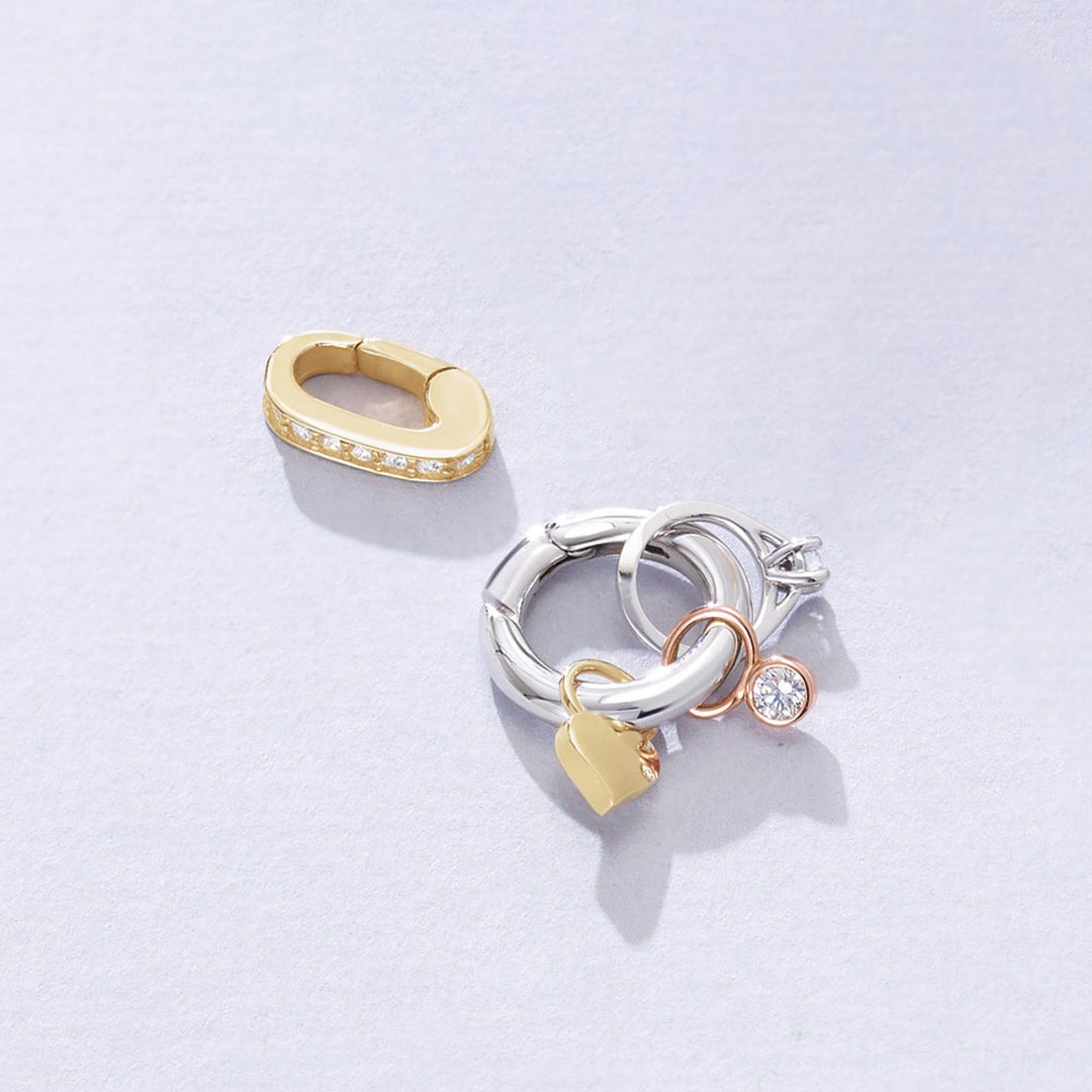 The 14K gold round clasp adds charm, perfect for stacking, personalization and versatility, while the oval diamond clasp adds sparkle.