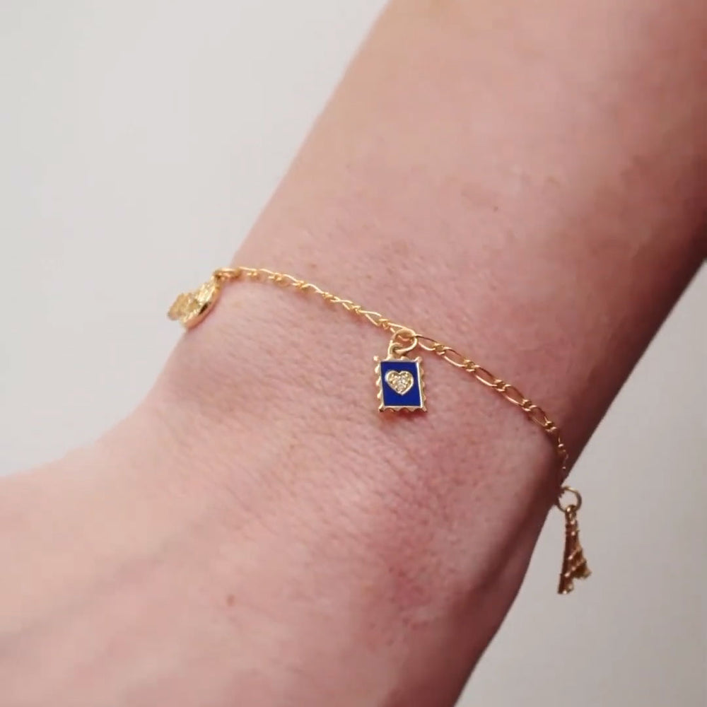 14K gold miniature diamond stamp dangle on bracelet.