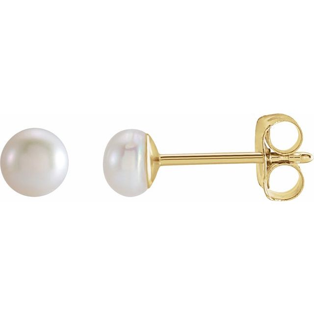 14k gold miniature pearl dainty stud earrings.