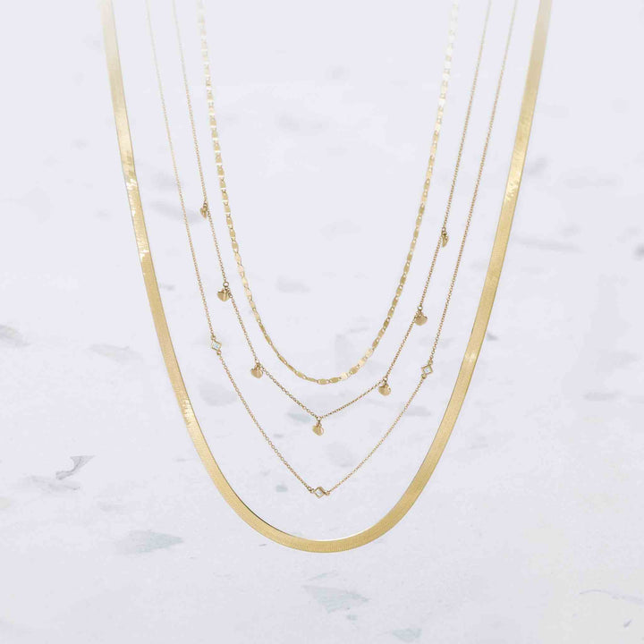 2.7mm mirror Valentino link chain layed with heart dangle station necklace- square station necklace- 4.6mm Herringbone chain.