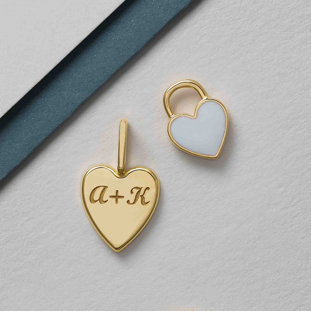 Heart-shaped pendant engraved with a customized message.