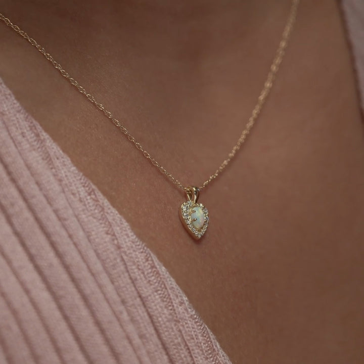 14k gold opal halo pendant on chain.