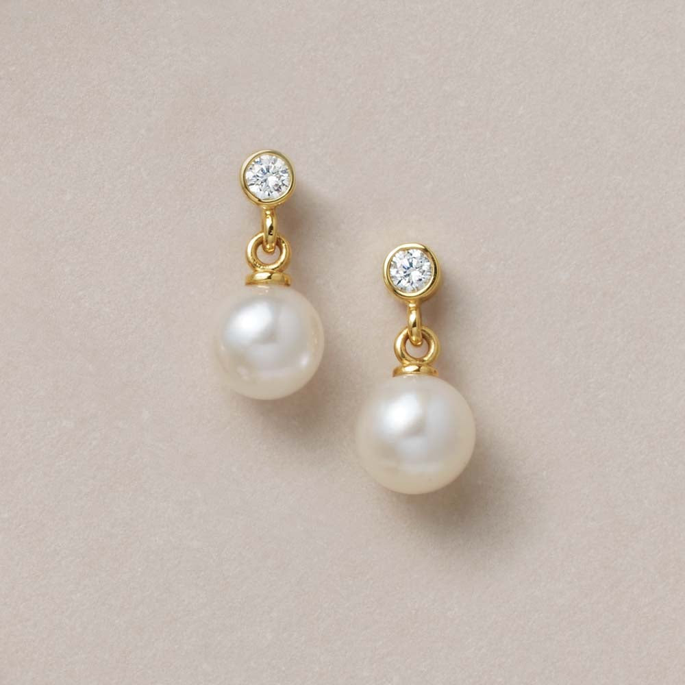 Akoya pearl diamond dangle earrings in 14k yellow gold..
