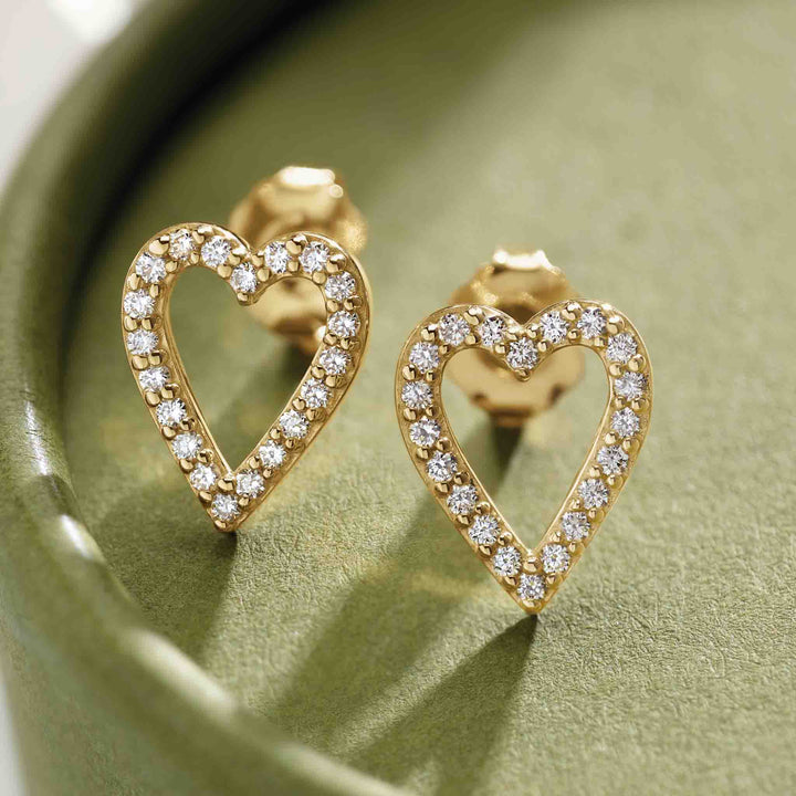 14k gold miniature diamond open heart stud earrings enlarge view.