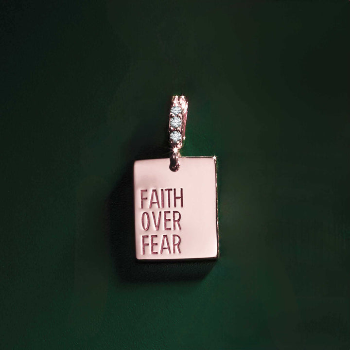 14k rose gold diamond "Faith Over Fear" pendant.