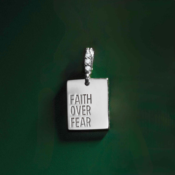 14k white gold diamond "Faith Over Fear" pendant.
