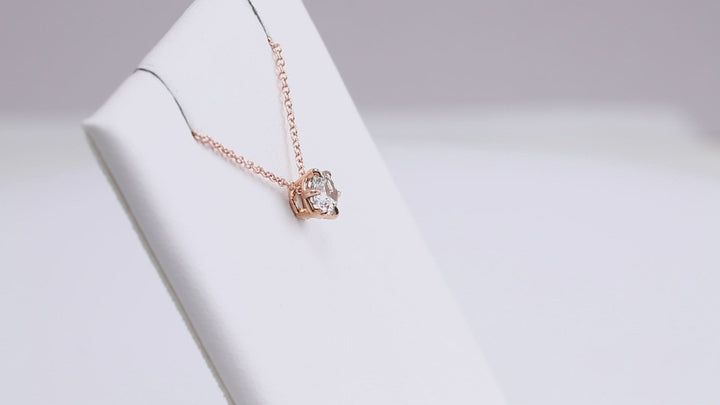 14K rose gold round solitaire slide necklace.